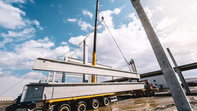 crane hoisting structural steel beams