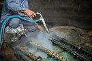 millwright cleaning gears and equipment using dry ice blasting