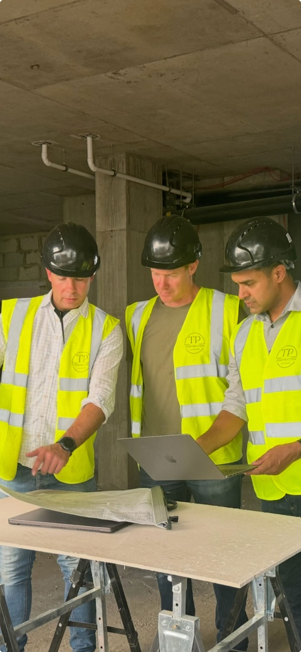 TP Facades Team working with drawings