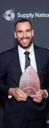 Jack holding Young Entrepreneur of the year 2022 award