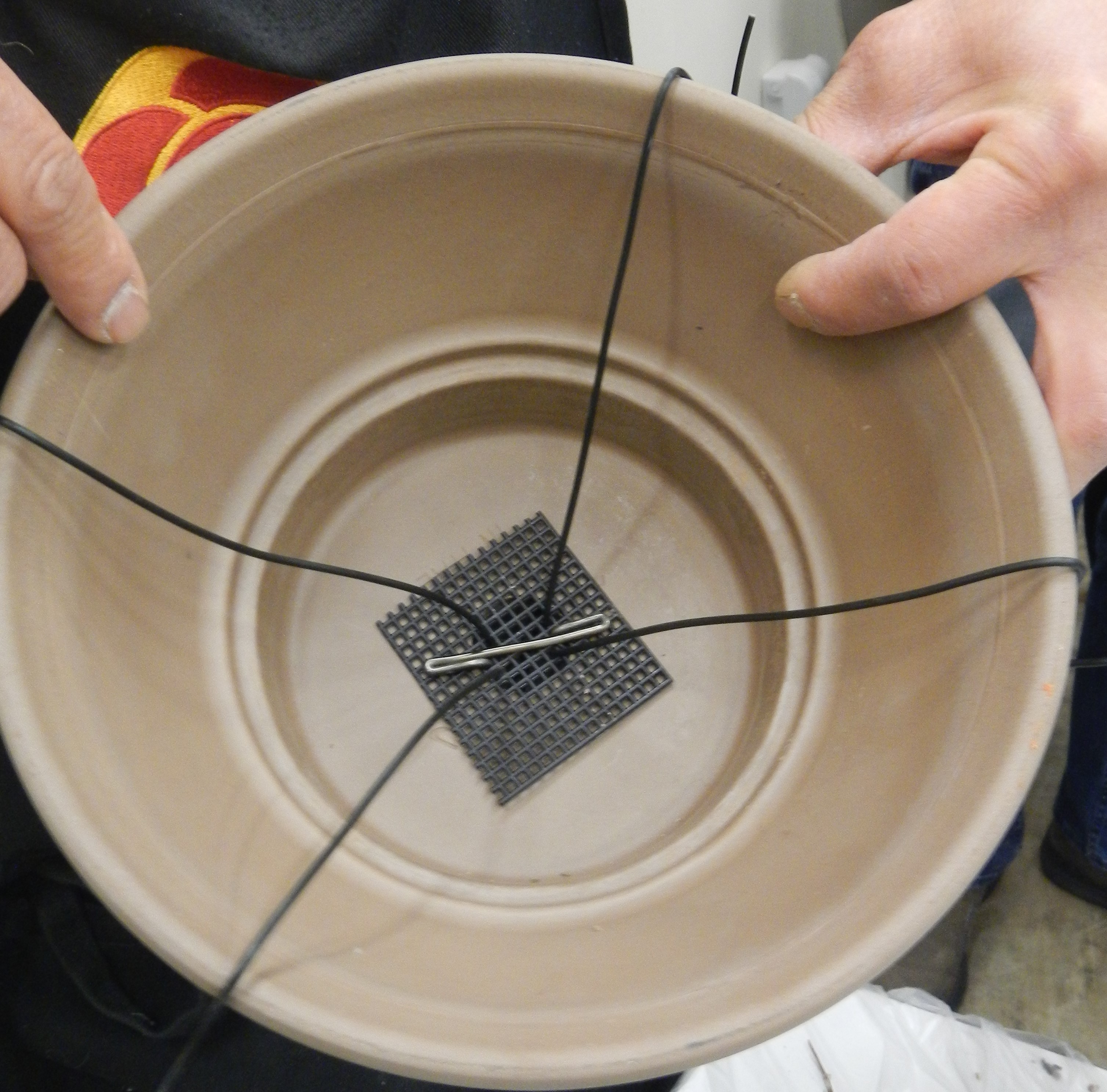 Tie-down wires for one-hole pot