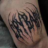 Blackwork abstract font tattoo by Josh