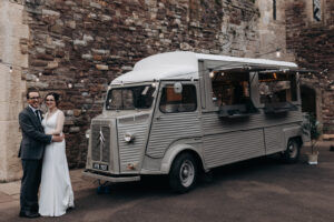 Food truck at wedding with bride and groom