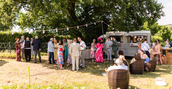 Guests gathered around a food truck at an outdoor event