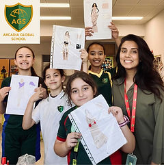 Kids fashion design class in Dubai — students showing their finished design and sewin work