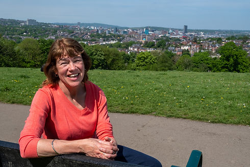 Jill Valentine sitting on the famous bench looking over Sheffield. 