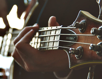 Hands on a guitar neck_edited_edited.jpg