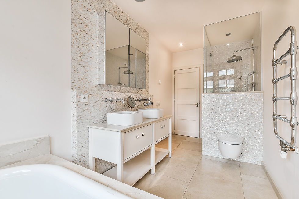 An elegant and immaculate bathroom adorned with tasteful fixtures, soft ambient lighting, and luxurious accents, creating a serene and sophisticated atmosphere for relaxation and self-care.