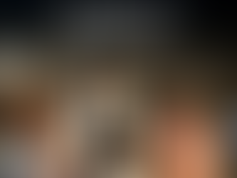 Chef serving dessert to a delighted couple at a restaurant. Text: "Up to $1,000 onboard credit, Azamara Cruises." Elegant dining setting.