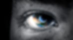 Close-up of an eye with Earth's reflection in the iris, blending grayscale with vibrant colors, creating a contemplative and imaginative mood.