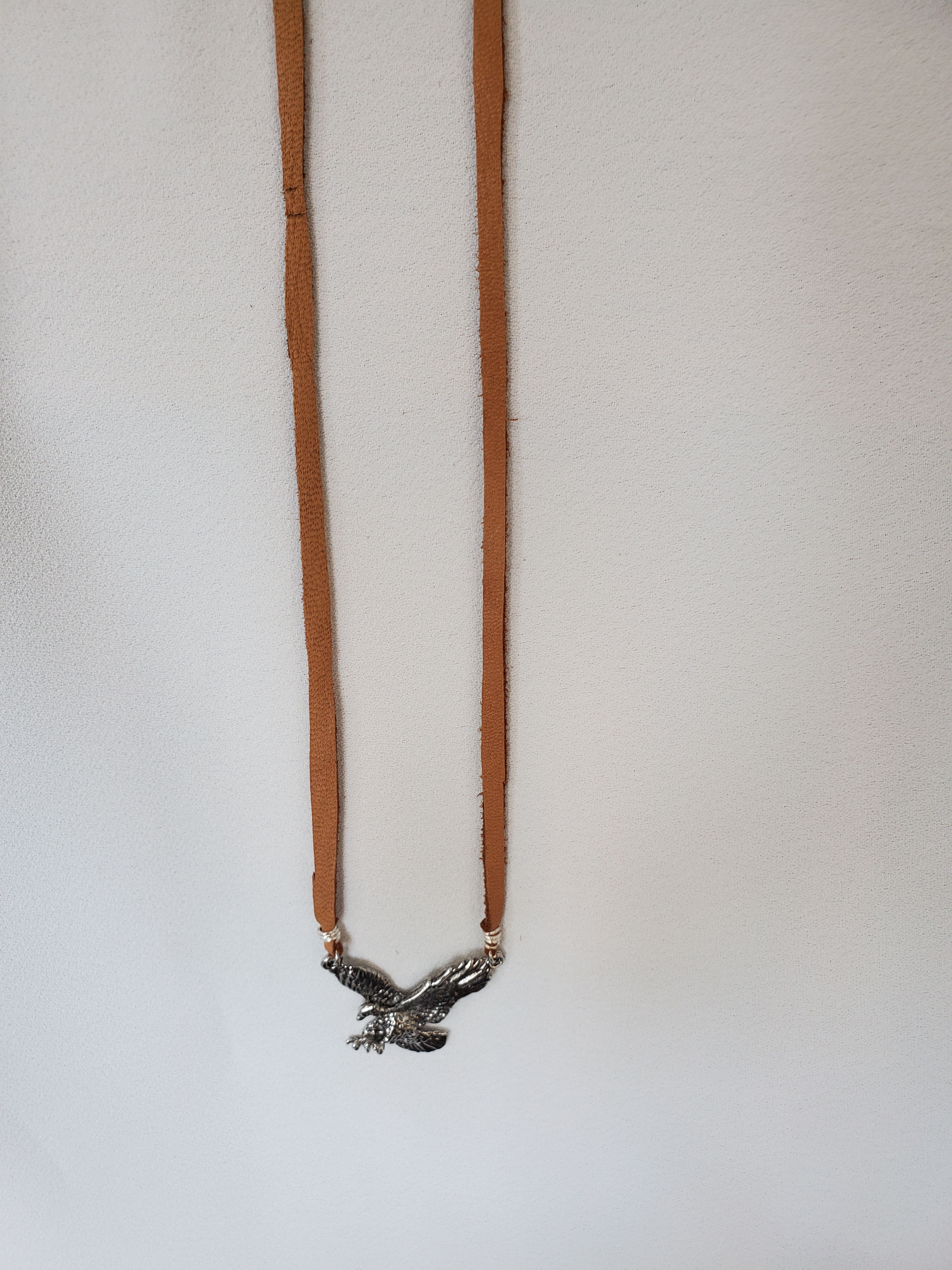 Eagle with leather necklace