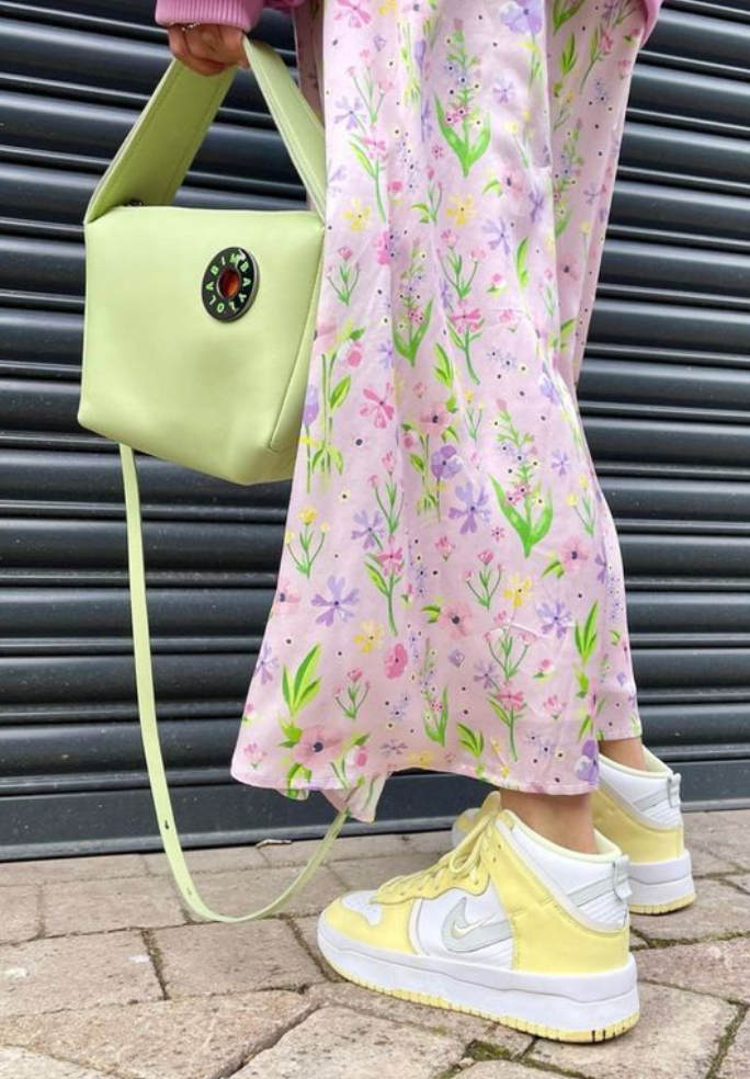 Accessorise your floral dress with brightly coloured trainers in summer 2025