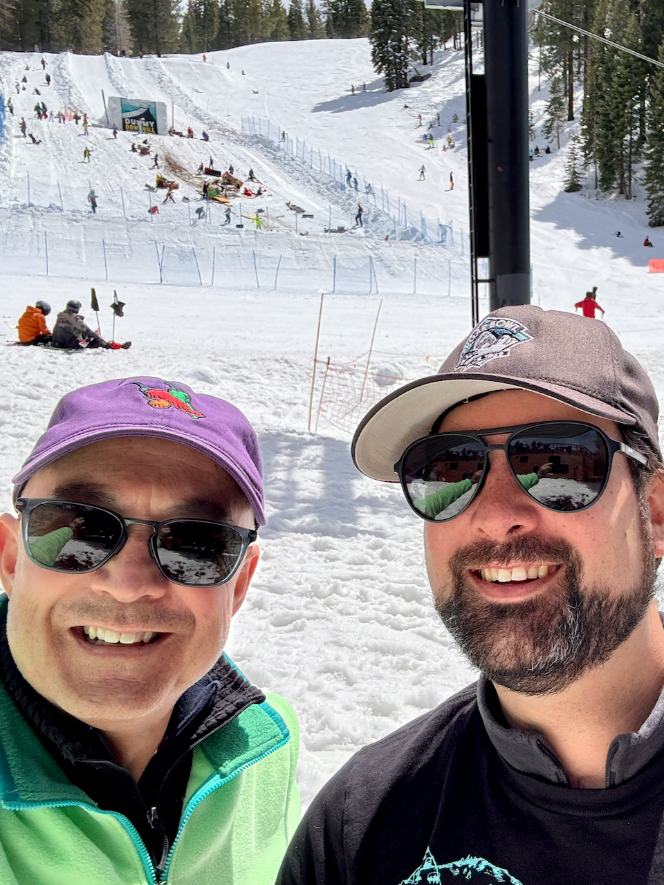 two men in front of ski jump