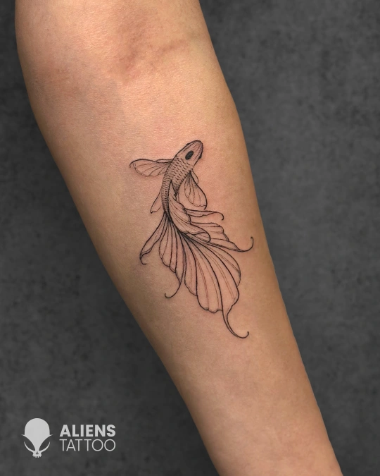 Minimal fine line fish tattoo on forearm at best tattoo studio in Delhi GK1