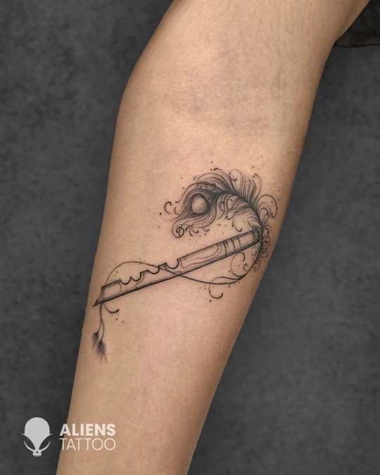 Minimal linework flute tattoo with ornamental details at best tattoo studio in Delhi GK1