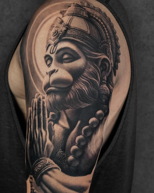 Black and grey Hanuman portrait tattoo with praying hands at best tattoo studio in Delhi GK1