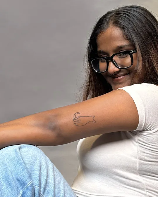 Smiling with new cat tattoo - Aliens Tattoo