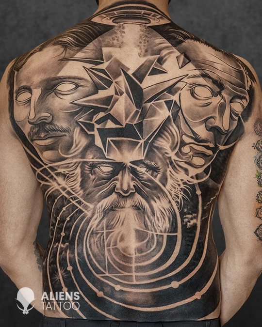 Large black and grey abstract realism back tattoo featuring multiple faces, geometric elements, and spiritual symbolism, created by Aliens Tattoo, the best tattoo studio in pune.