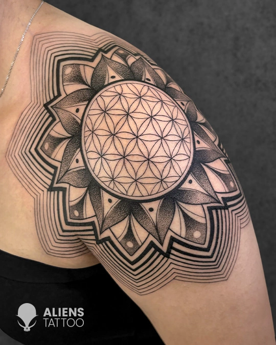 Intricate geometric mandala tattoo with dotwork shading and sacred geometry design on the shoulder, expertly inked by Aliens Tattoo, the best tattoo studio in pune.