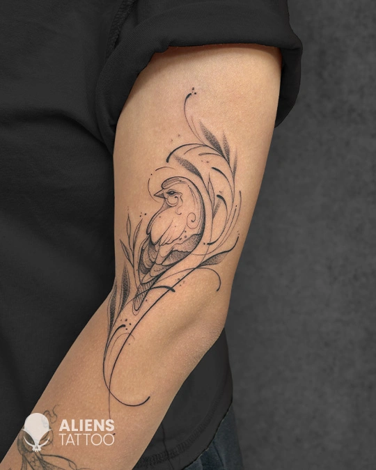 Elegant fine-line bird tattoo