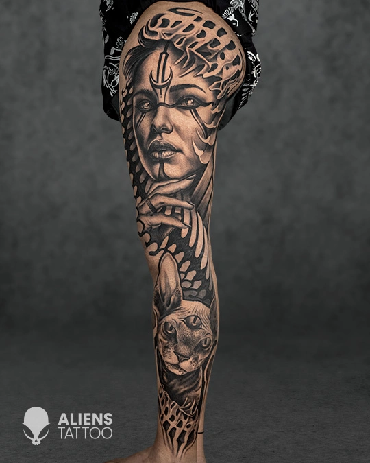 Surreal female portrait tattoo with ornamental patterns and cat design in black and grey realism style