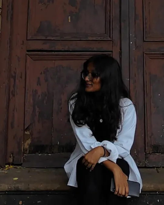 Woman in quiet moment before tattoo - Aliens Tattoo