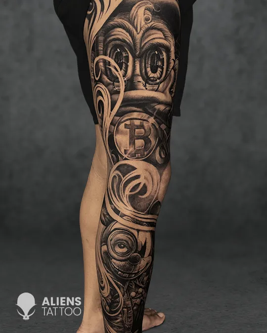 Black and grey biomechanical sleeve tattoo with Bitcoin symbol by top tattoo artist in Kolkata
