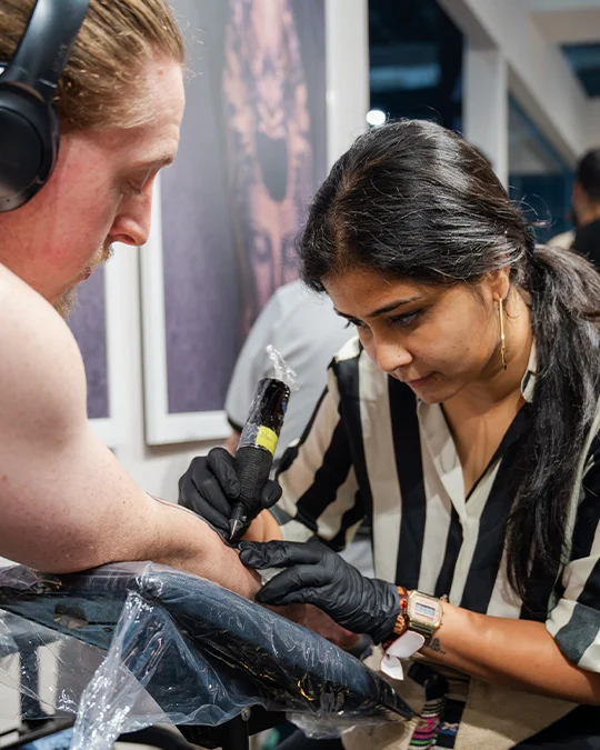 female tattoo artist at Aliens tattoo
