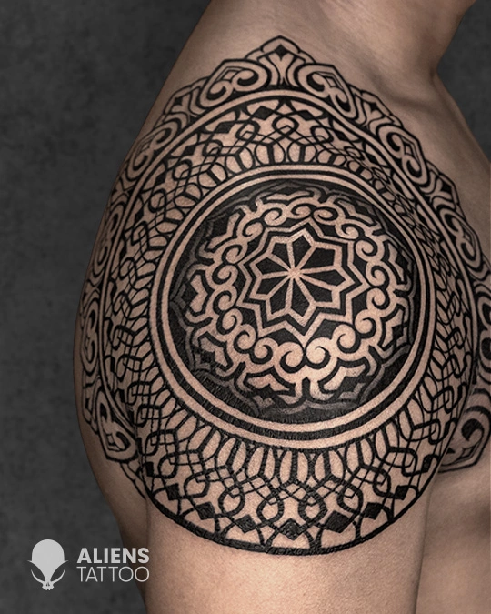 Intricate geometric mandala tattoo with bold linework done at the best tattoo studio in Hyderabad