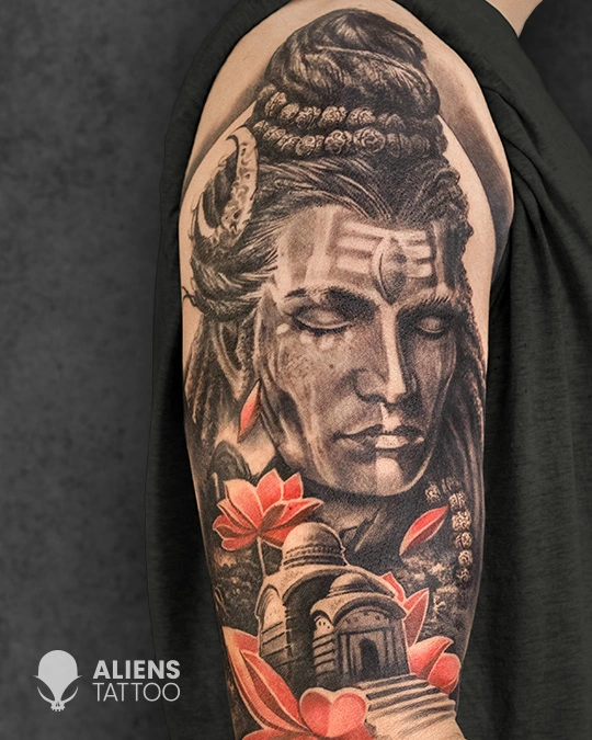 Realistic Lord Shiva portrait tattoo with lotus and temple details done at the best tattoo studio in Hyderabad