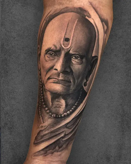 Intricate miniature realism tattoo by Tejas Navaskar, top tattoo artist in Pune