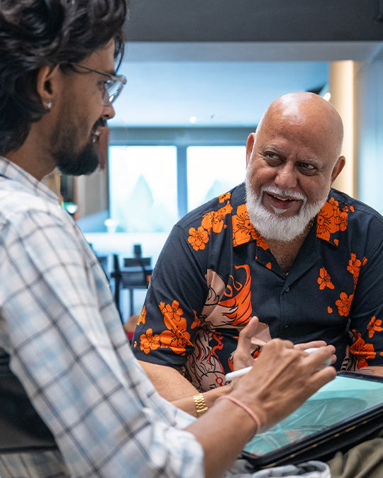 client discussing his tattoo idea with our artist in tattoo studio in kochi