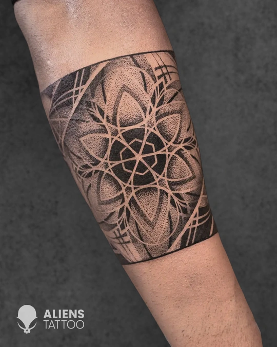 Geometric armband tattoo with dotwork pattern at best tattoo studio in Delhi GK1