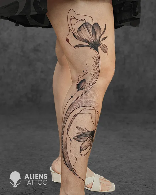 Elegant floral leg tattoo at the best tattoo studio in Kolkata