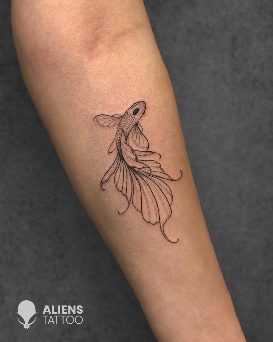 Fine line koi fish tattoo on forearm with flowing fins in minimalist style