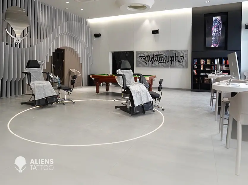 Spacious and modern interior of Aliens Tattoo studio with professional tattoo chairs, clean layout, and premium setup, showcasing the experience at the best tattoo studio in pune.