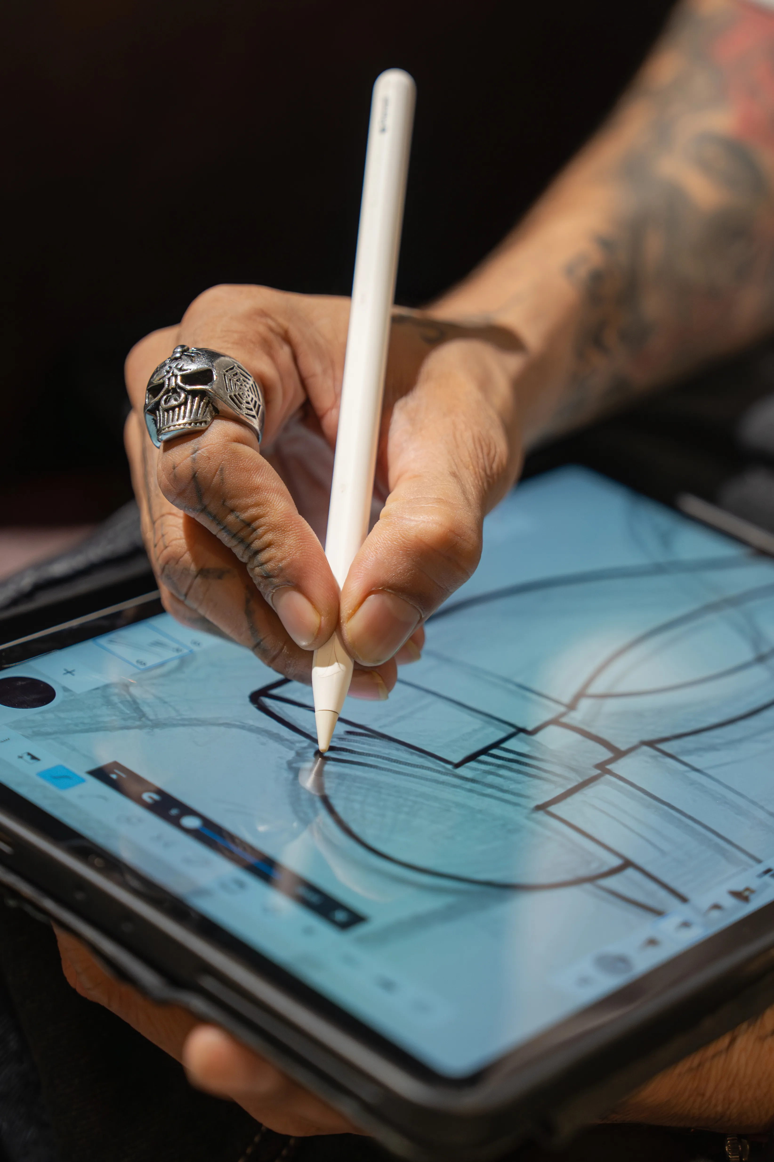 Tattoo artist creating World Cup trophy design artwork on iPad – Aliens Tattoo