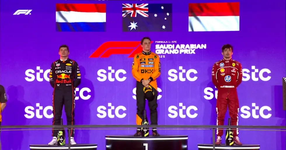 Max Verstappen (L), Oscar Piastri (C), and Charles Leclerc (R) on podium.