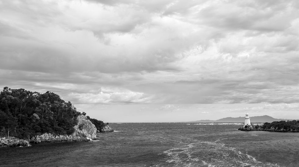 black and white photograph of Hells Gate, the entrance to Macquarie Harbour