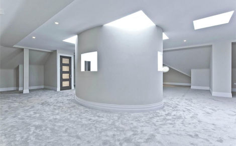 Modern minimalist attic interior with central curved wall