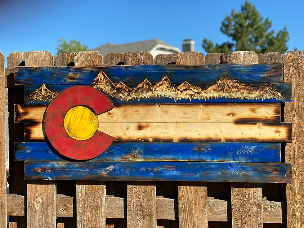 Colorado flag with hand carved mountains