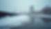 Eye-level view of a Twin Cities commercial building roof with snow melting and visible wear