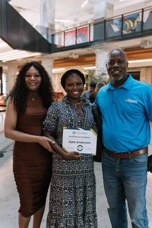 Adult career training graduate holding a certificate.