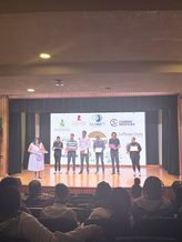 Participants in workforce training partnerships on stage.