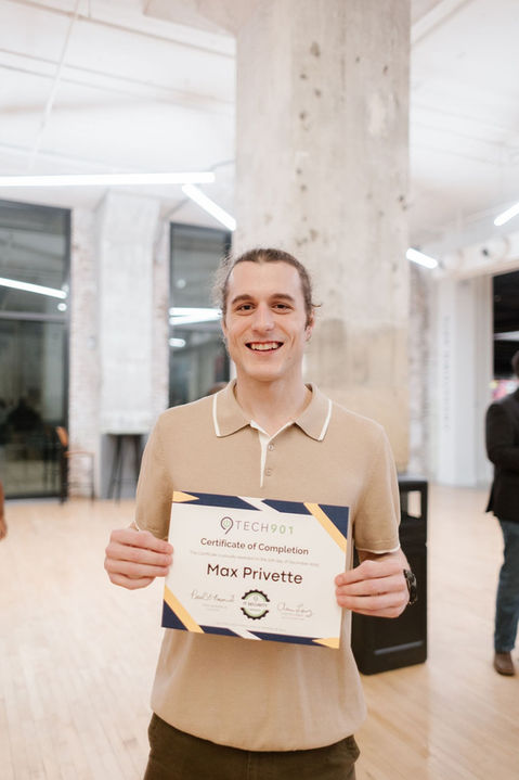 Graduate holding a certificate from IT Training Memphis.