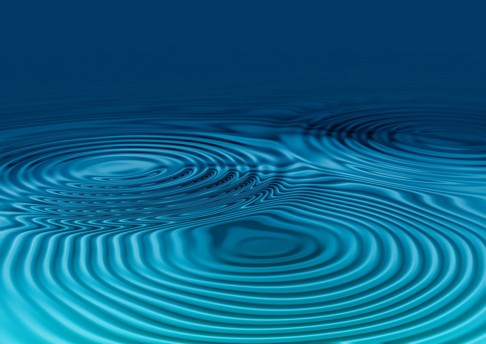 3 Wellenringe im Wasser