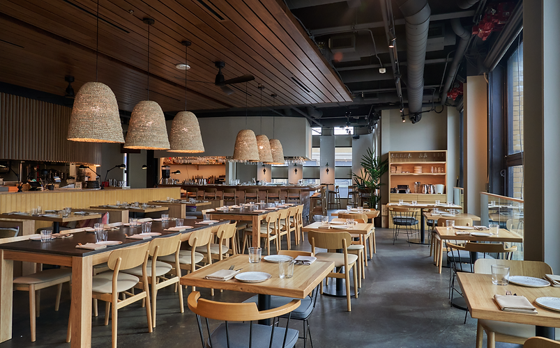 Teleferic Barcelona Walnut. Creek Main Dining Room. Inside a restaurant, tables and chairs walnut inspired are set up for guests to enjoy their meals.