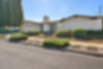 Single-story residential home exterior photographed from the street