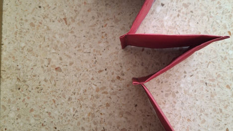 A birds-eye view of a small section of an accordion book made out of cotton fabric.