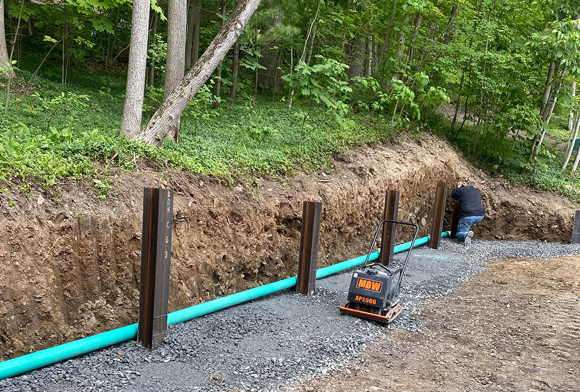A new drainage system will prevent water damage to your driveway.